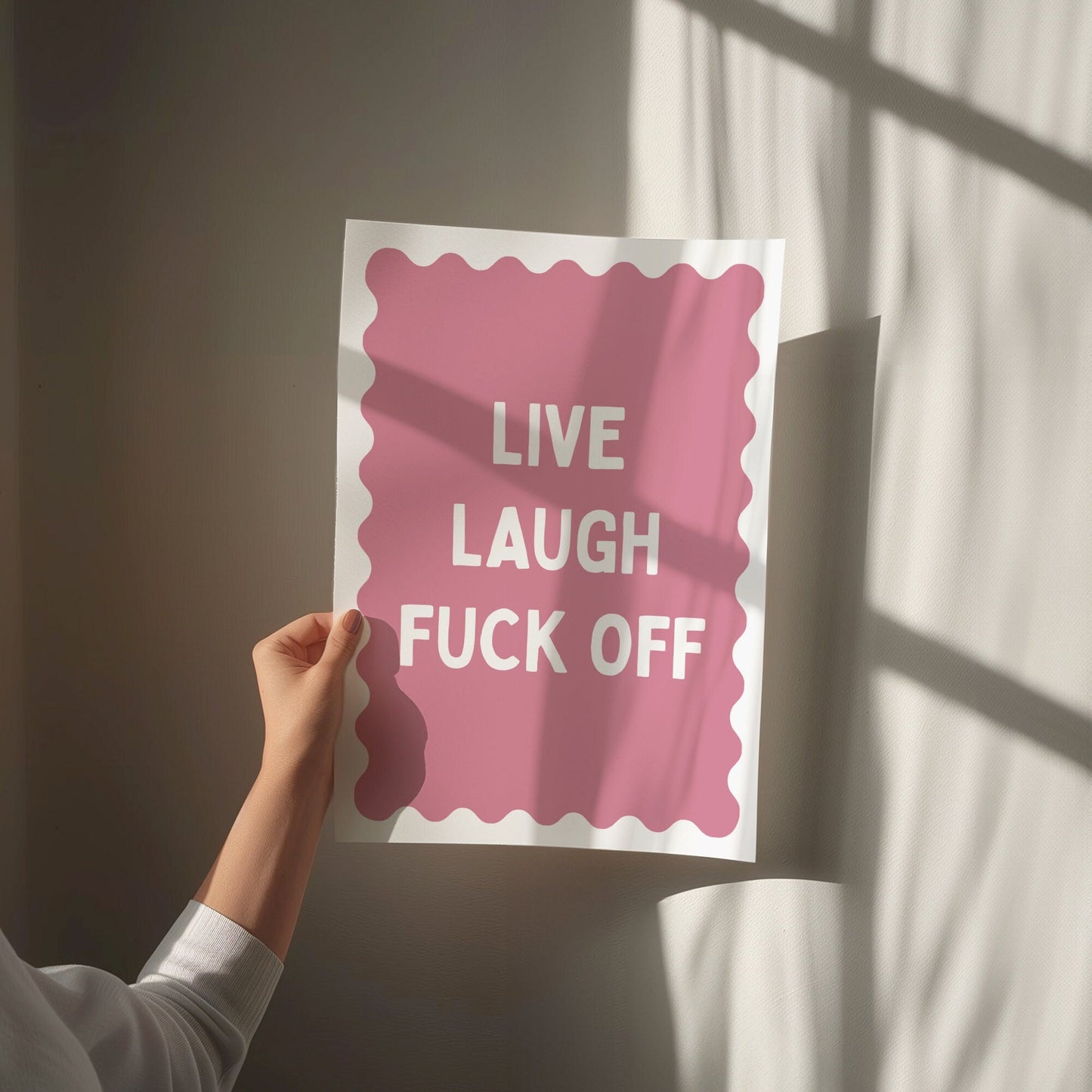 live laugh fuck off pink and white wall print