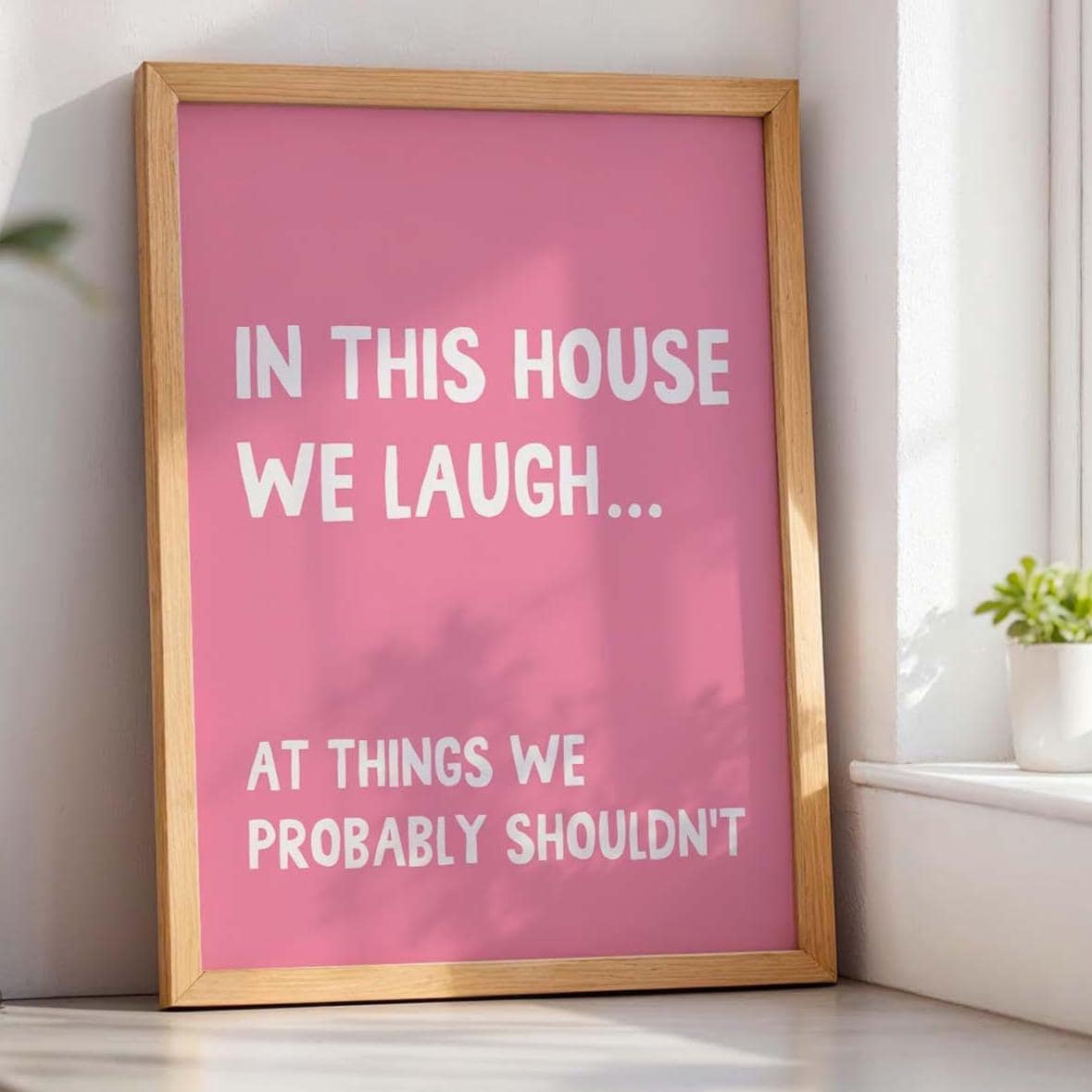 In This House We Laugh At Things We Probably Shouldnt Art Print Pink and White
