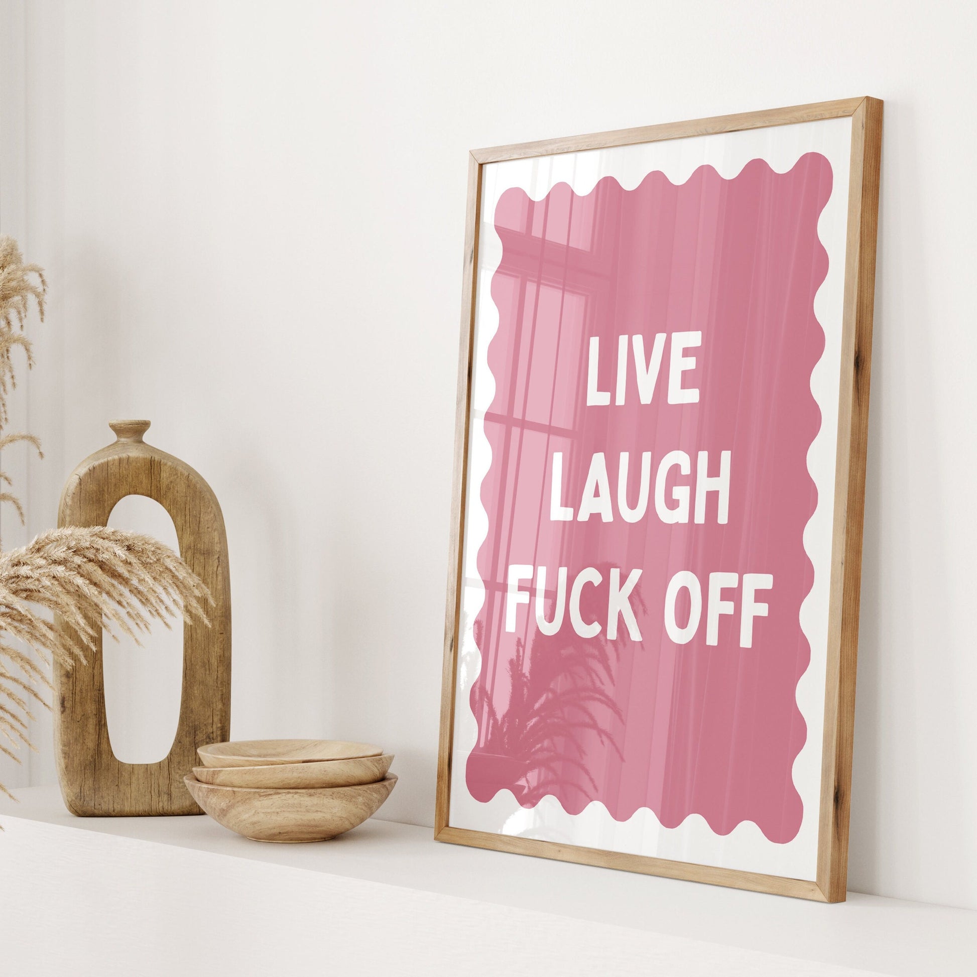 live laugh fuck off pink and white wall print